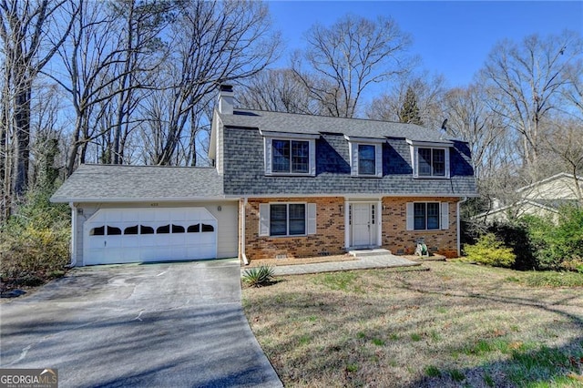 colonial inspired home featuring driveway, brick siding, roof with shingles, an attached garage, and a front yard