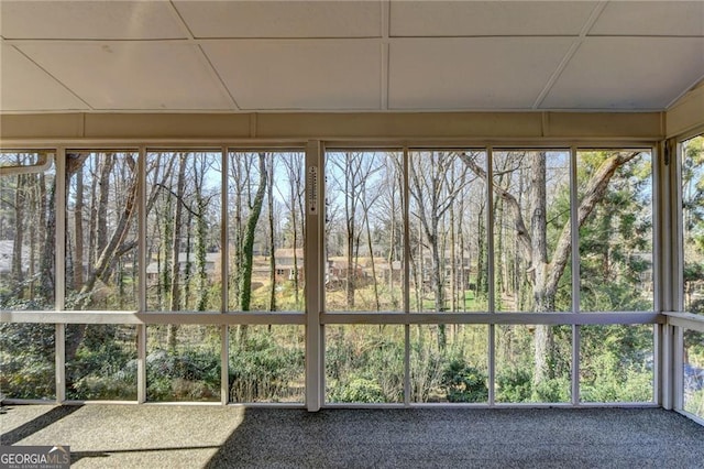 unfurnished sunroom featuring plenty of natural light