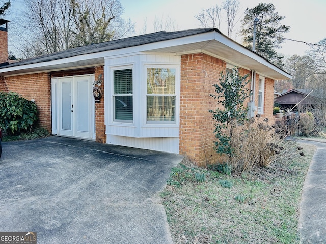 view of home's exterior with brick siding