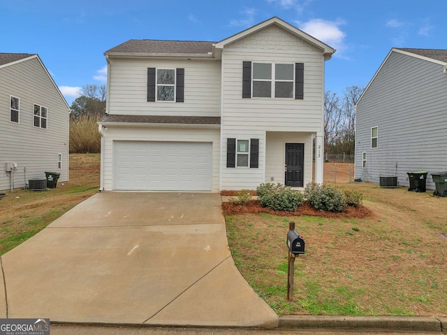 traditional-style house featuring a garage, central AC unit, a front lawn, and concrete driveway