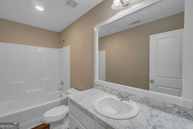 full bathroom featuring toilet, bathing tub / shower combination, vanity, and visible vents