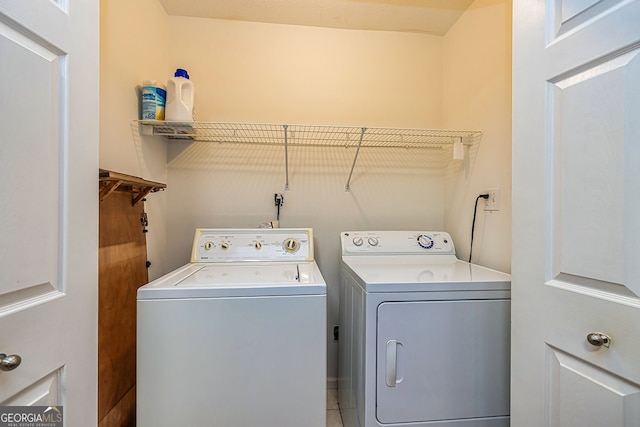 laundry room with laundry area and washing machine and clothes dryer