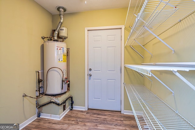 utility room with gas water heater