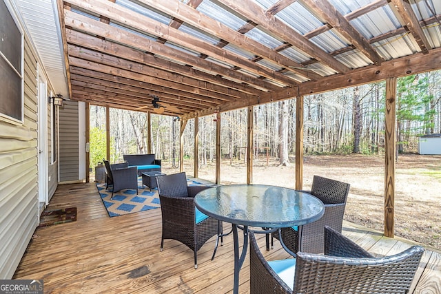 deck with a ceiling fan and outdoor dining area