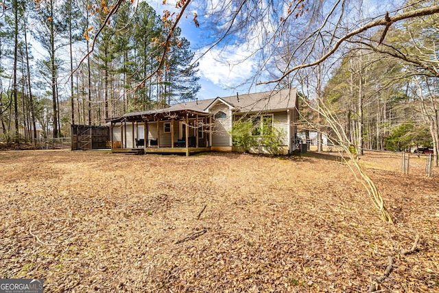 exterior space featuring fence and a wooden deck