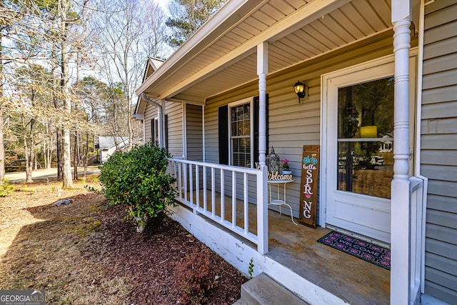 view of exterior entry featuring a porch