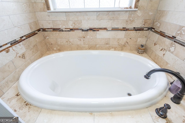 bathroom featuring a washtub