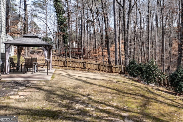 view of yard featuring a patio area, fence, and a gazebo