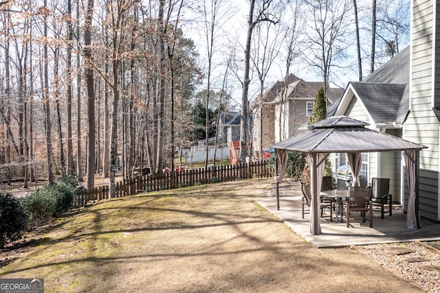 view of patio / terrace featuring fence and a gazebo