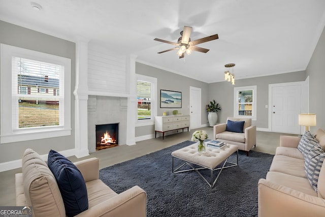 living room with ceiling fan, a fireplace, and baseboards