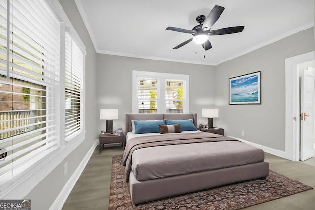 bedroom with baseboards, ceiling fan, wood finished floors, and crown molding