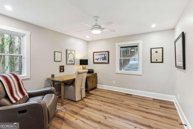 office featuring light wood-style flooring, recessed lighting, visible vents, a ceiling fan, and baseboards