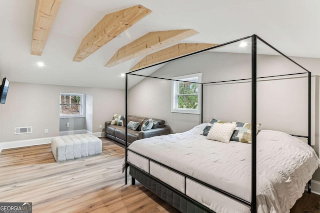 bedroom with baseboards, visible vents, wood finished floors, vaulted ceiling with beams, and recessed lighting