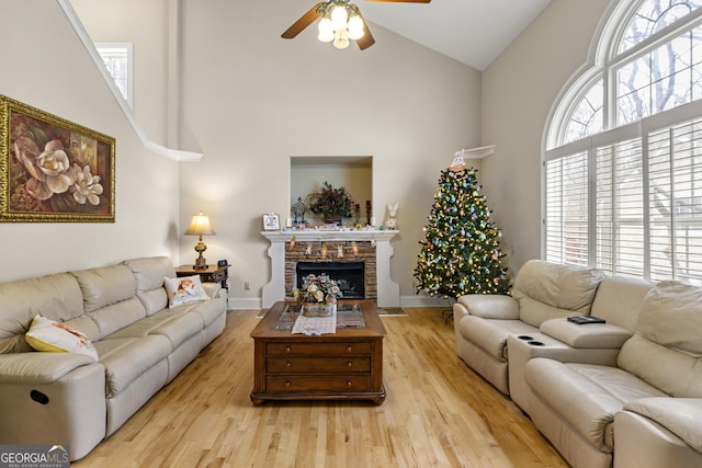4010 Tamarack Dr NW, Kennesaw, GA 30152 - living area featuring baseboards, a fireplace, wood finished floors, high vaulted ceiling, and a ceiling fan
