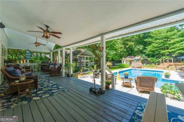 4010 Tamarack Dr NW, Kennesaw, GA 30152 - wooden terrace with outdoor lounge area, fence, an outdoor pool, and ceiling fan
