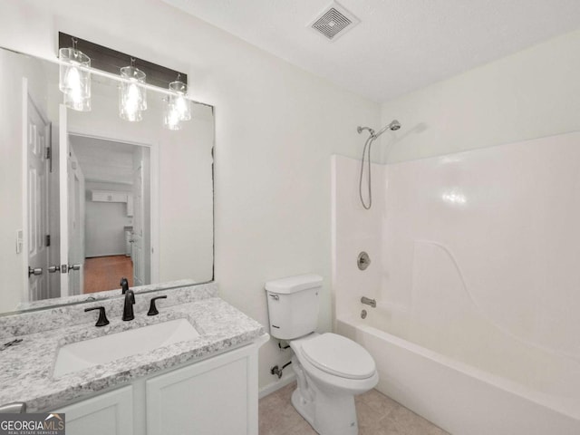 full bathroom with visible vents, shower / bathing tub combination, toilet, vanity, and tile patterned floors