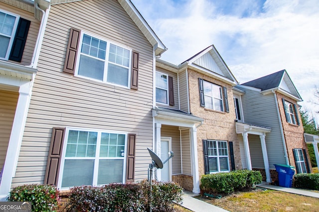 multi unit property featuring brick siding