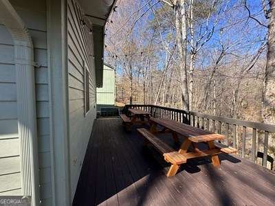 wooden terrace with a garage