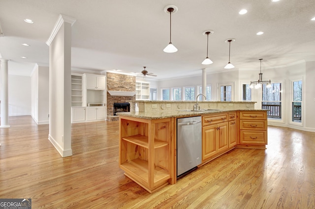 kitchen featuring a sink, stainless steel dishwasher, open shelves, an island with sink, and pendant lighting