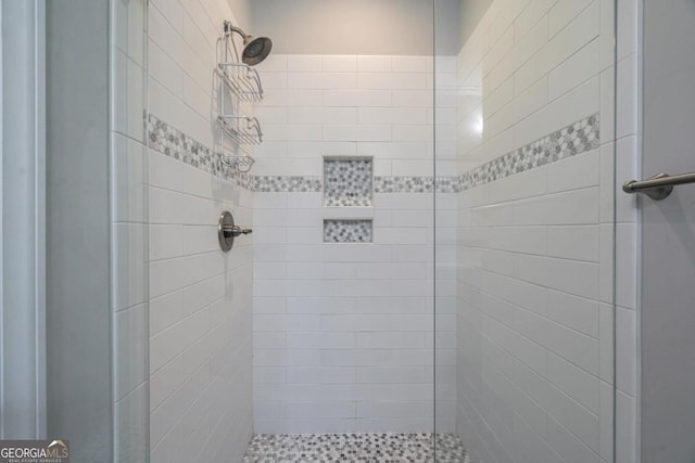 full bathroom featuring a shower stall