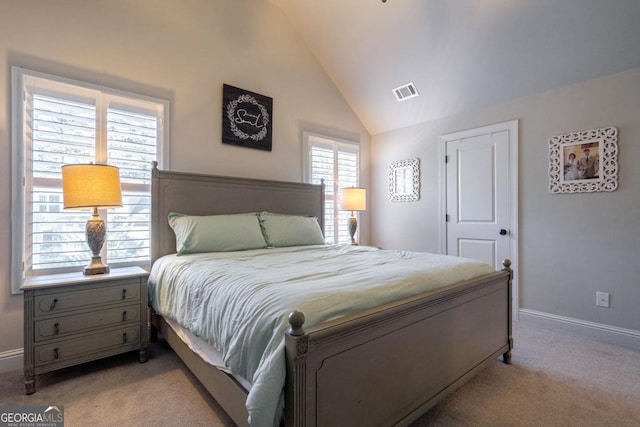 bedroom with light carpet, baseboards, visible vents, and vaulted ceiling