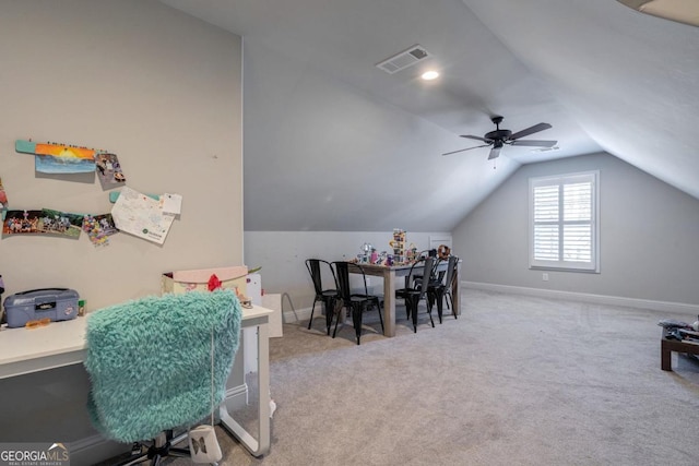 dining room featuring light colored carpet, visible vents, vaulted ceiling, and baseboards