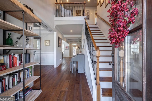 entrance foyer with dark wood-style floors, a wealth of natural light, and a decorative wall