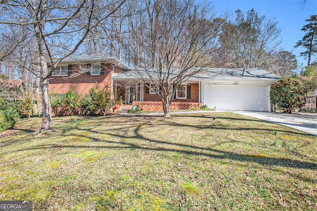 view of front of home with a front yard, brick siding, driveway, and an attached garage