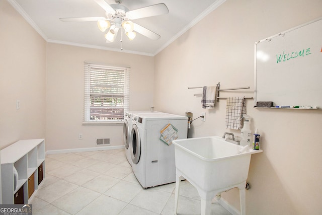 laundry area featuring laundry area, separate washer and dryer, visible vents, baseboards, and ornamental molding