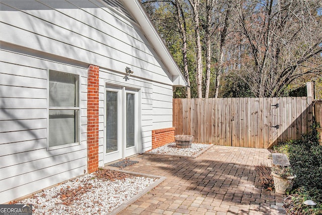 view of patio featuring fence