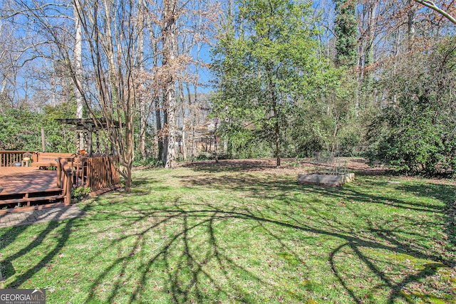 view of yard with a deck