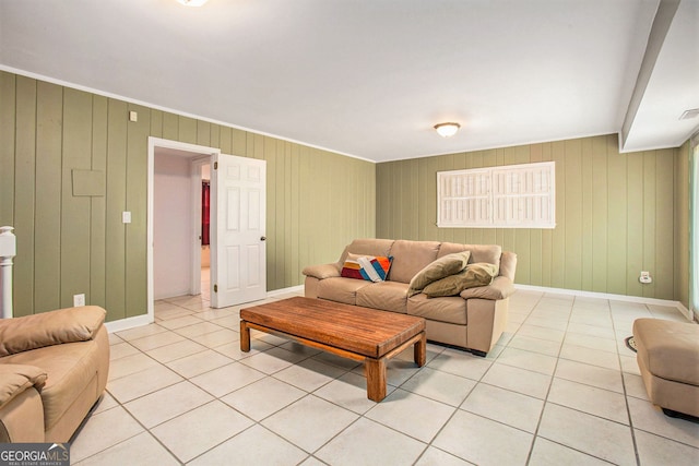 living room featuring light tile patterned floors, visible vents, and baseboards