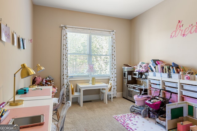 playroom featuring carpet floors and baseboards