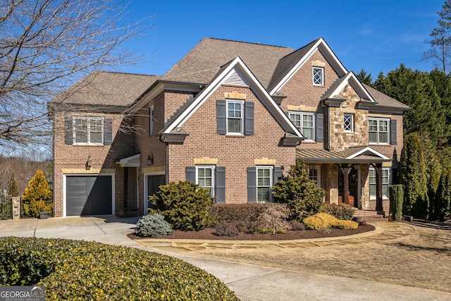 view of front facade with a garage, driveway, brick siding, and a shingled roof