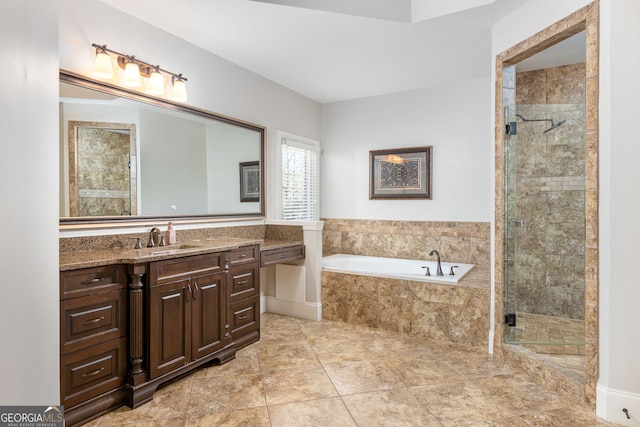 bathroom featuring a garden tub, a shower stall, and vanity