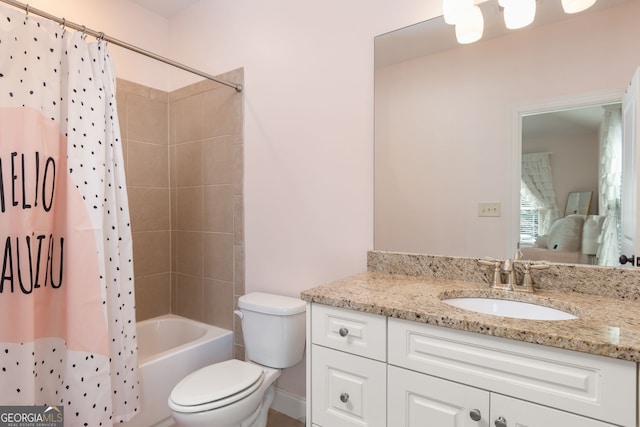 full bathroom featuring shower / bathtub combination with curtain, vanity, and toilet