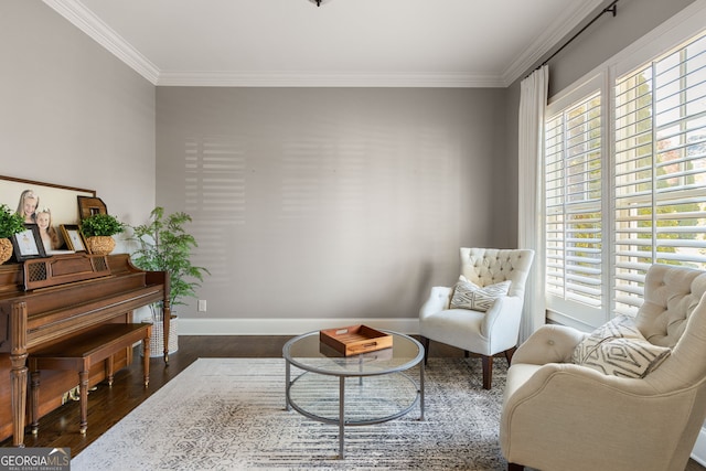 sitting room featuring ornamental molding, dark wood-type flooring, and baseboards