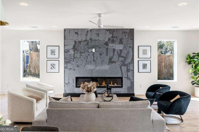 1273 Danner St SE, Atlanta, GA 30316 - living area with a fireplace, wood finished floors, recessed lighting, baseboards, and a ceiling fan