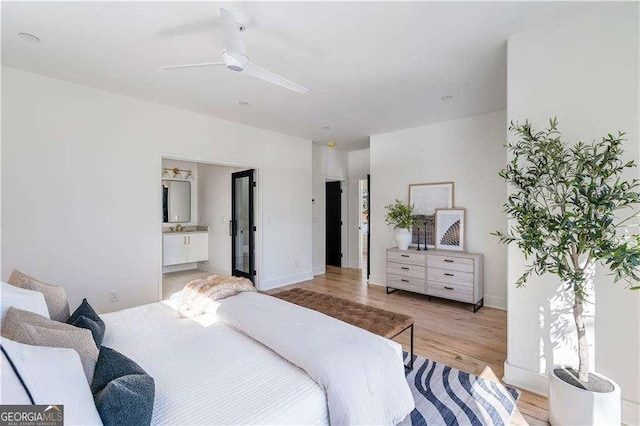 1273 Danner St SE, Atlanta, GA 30316 - bedroom featuring light wood-style floors, ensuite bath, baseboards, and ceiling fan