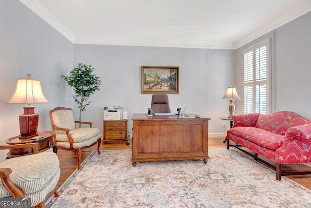 home office with ornamental molding and light wood-type flooring