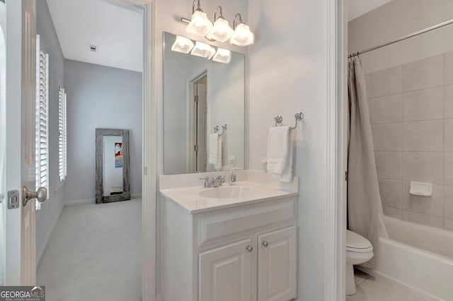 full bathroom with baseboards, toilet, tile patterned flooring, shower / bath combo with shower curtain, and vanity