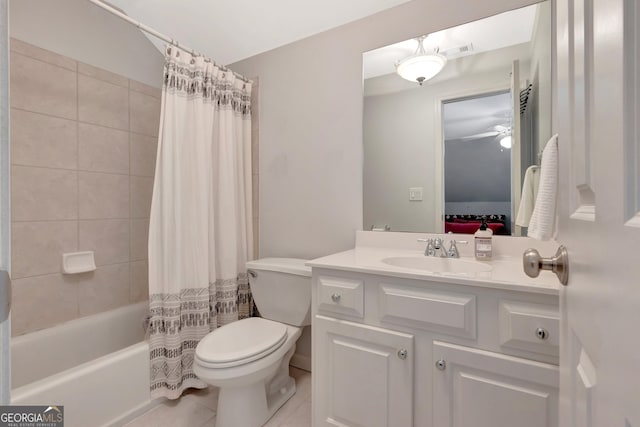 full bathroom with toilet, ensuite bathroom, shower / tub combo, vanity, and tile patterned flooring