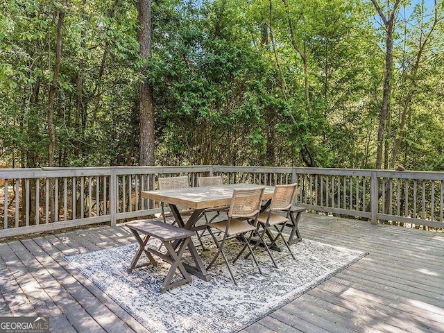 deck featuring outdoor dining area