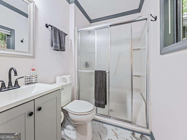 bathroom featuring toilet, a shower with shower door, marble finish floor, crown molding, and vanity