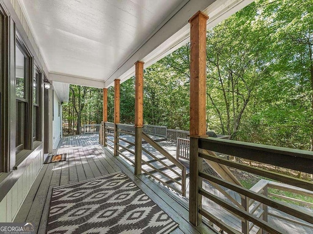 wooden deck featuring covered porch