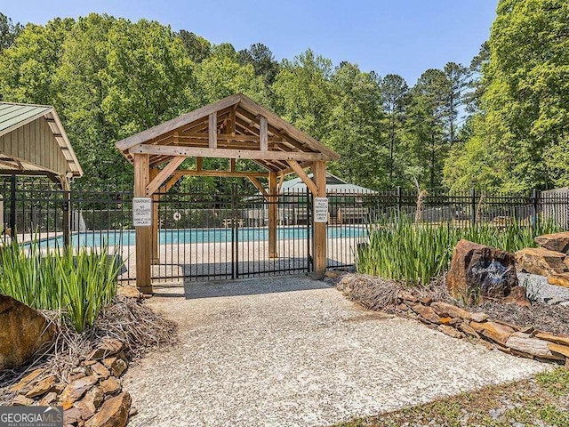 exterior space featuring fence and a gazebo