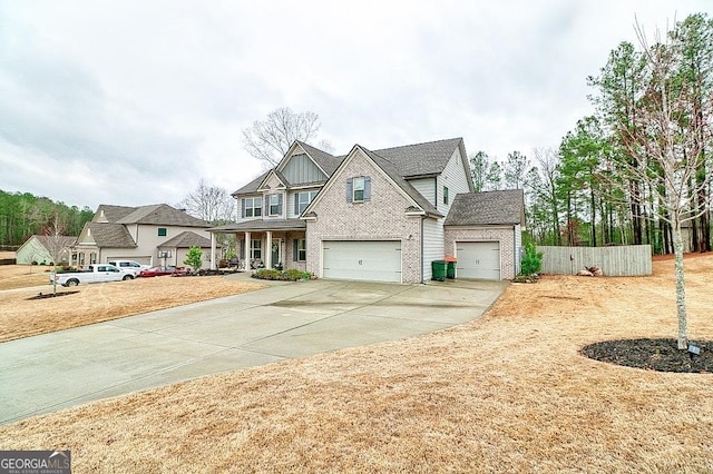 view of front of house with driveway, roof with shingles, fence, board and batten siding, and brick siding