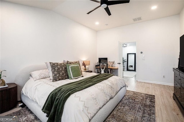 bedroom with recessed lighting, visible vents, light wood-style floors, vaulted ceiling, and baseboards