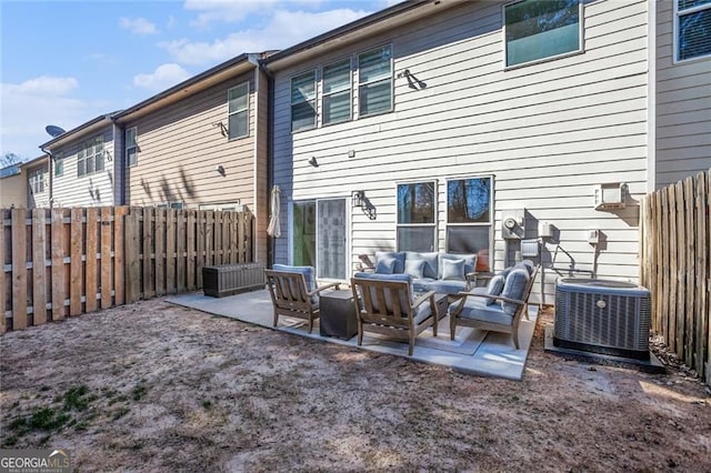 back of house with a patio area, a fenced backyard, an outdoor living space, and central air condition unit