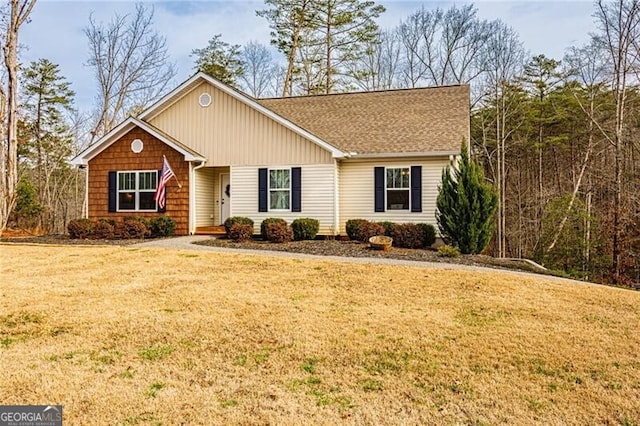 single story home featuring a front yard